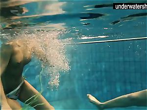 two magnificent amateurs flashing their figures off under water