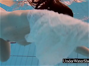 magnificent ginger-haired in the white sundress underwater